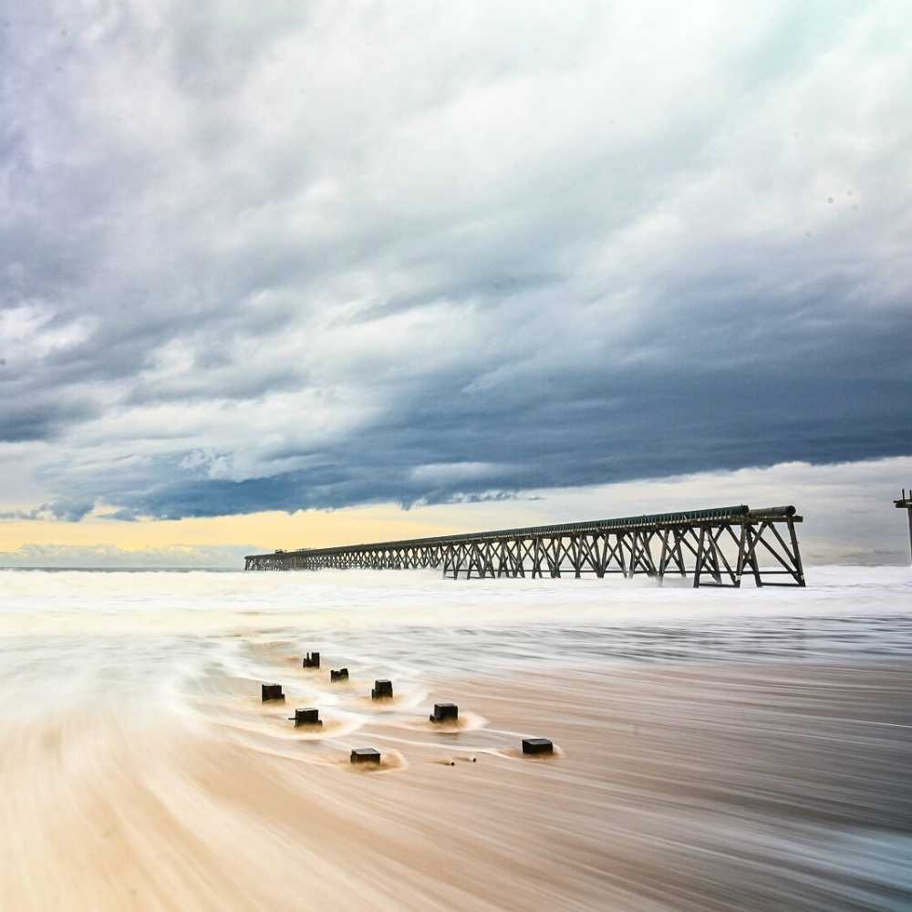 View of the Teesside coastline with sandy beach and calm sea – showcasing the natural beauty of the local area near Joslin Rhodes.