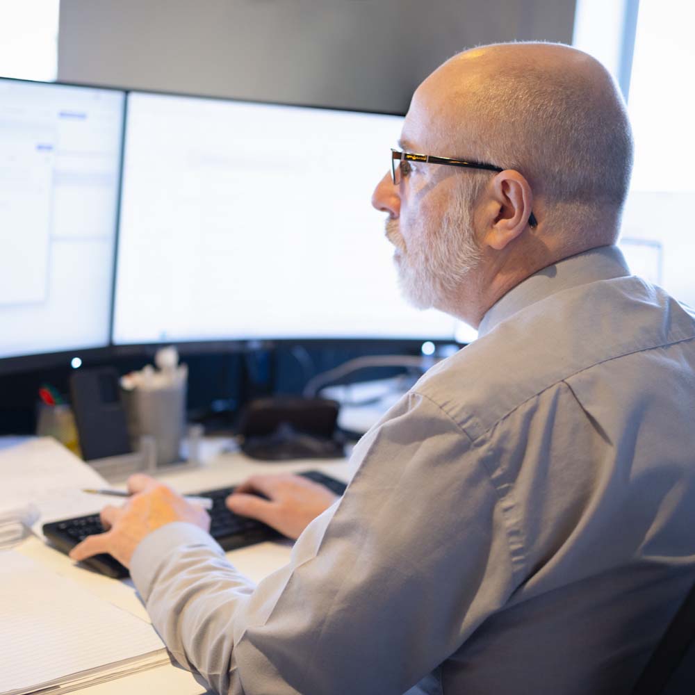 Joslin Rhodes team member working at a computer.